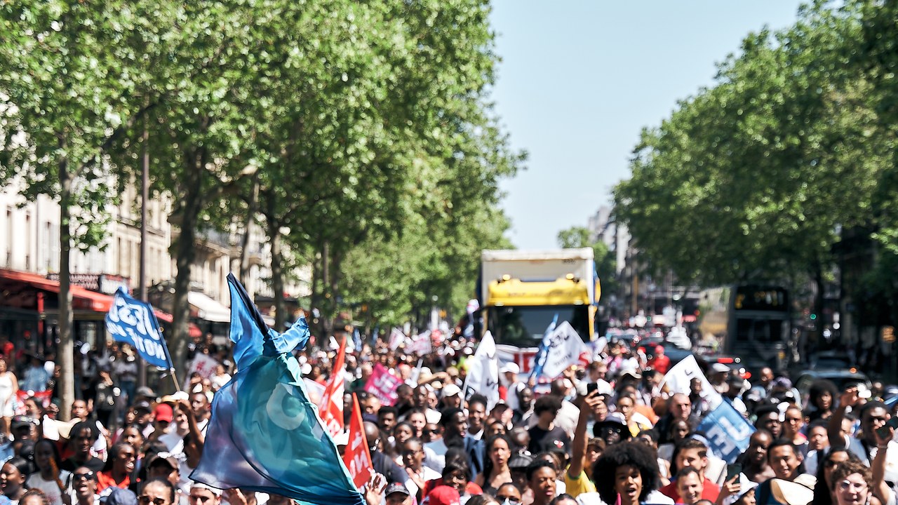 Marchers fill a Paris boulevard at Marche pour Jésus, June 2026